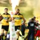 Hurricanes blow away Blues to book spot in Grand Final